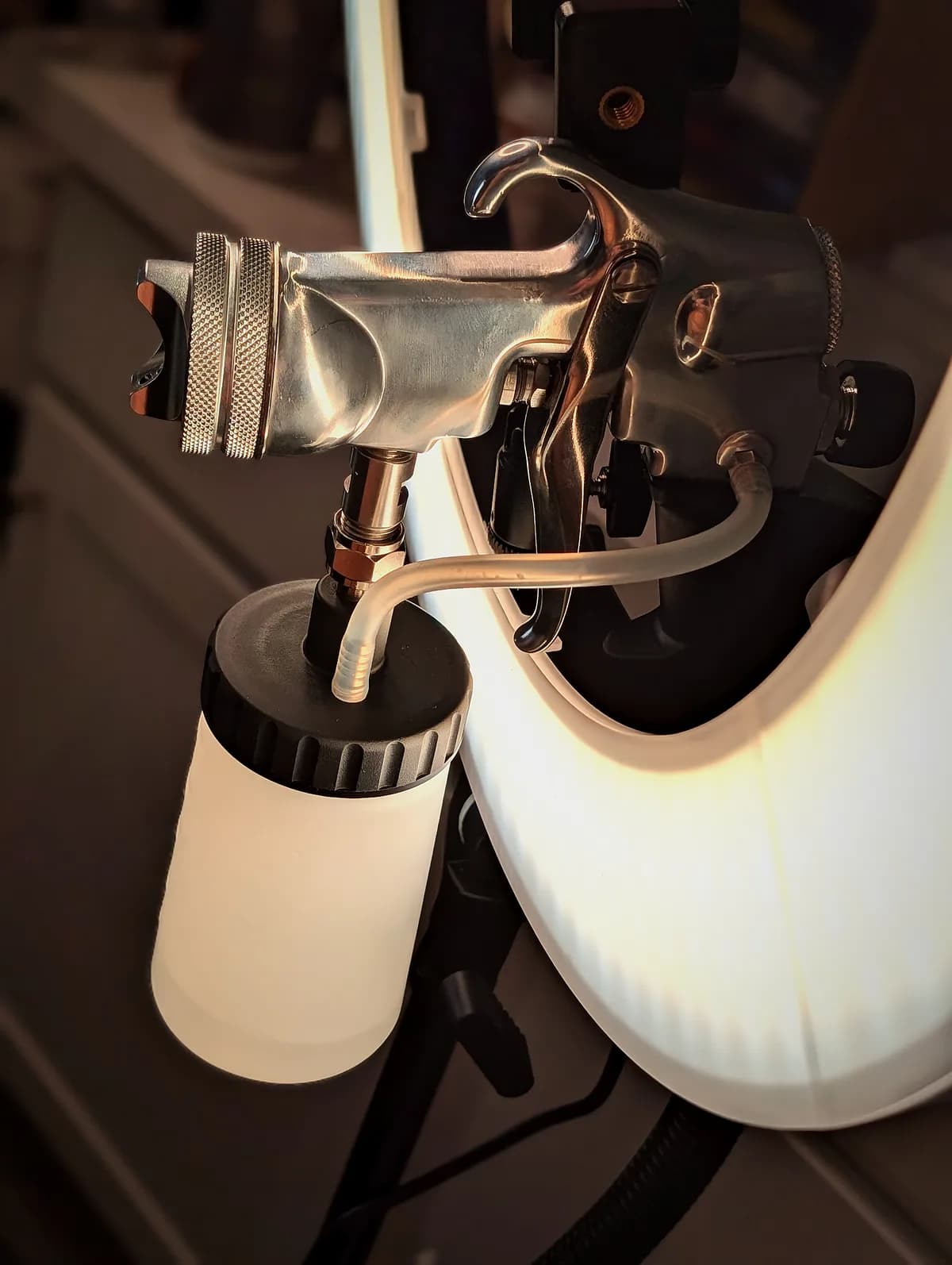 Glowtoure professional airbrush spray tan gun lit by a ring light in the private studio